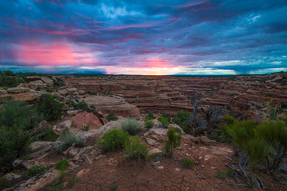 Sunrise lighting up virga over Road Canyon, Utah