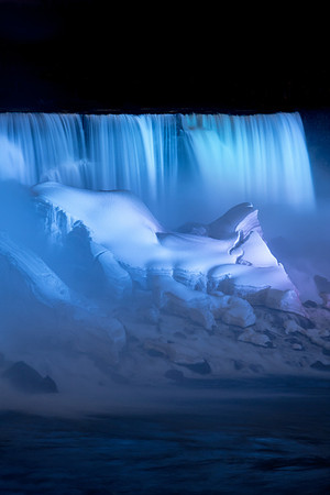 Ice formations at the base of Niagara Falls at night